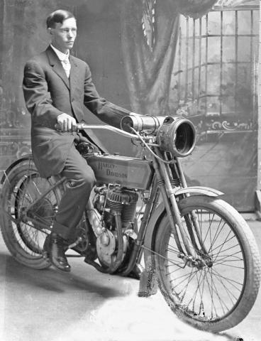 This appears to be a Harley-Davidson 1912 Model 8A. The photo is from the Ralph Rogers collection. The photo was taken at the Edmond Photo Studio on Patrick Street. The gentleman is unknown. | Dublin Historical Museum Archive photo