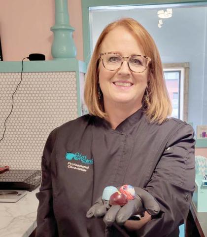 Susan Branham displays handcrafted, painted bonbons for sale at Hot Tempered Chocolates inside Blackjack Office Center. Branham is a world-class chocolatier and Dublin is appreciative of the new business. Wyndi Veigel | Citizen staff photo