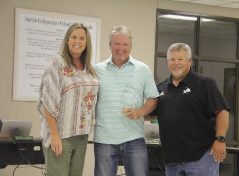 Paul Gaudette | Citizen staff photo Former Dublin ISD School Board Member Kent Crouch President of Dublin Bottling Works receives an appreciation award from Superintendent Melissa Summers and School Board President Bob Cervetto for his service on the board.