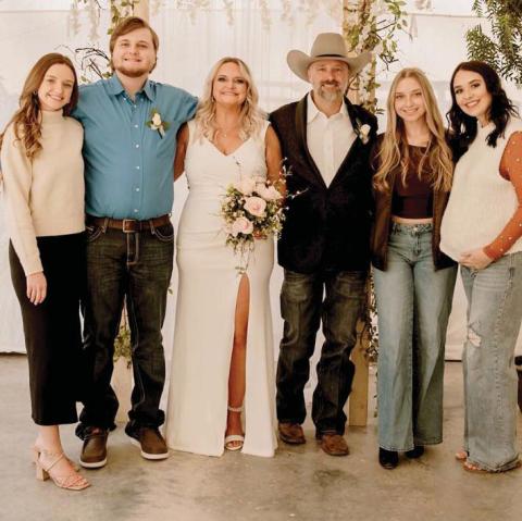 Quintin Noel, pictured in the cowboy hat at his wedding, enjoys life as a newlywed with his wife Mindy, biological daughter Bailey Wright and stepchildren, Shelby, Saydee and Dawson Hargrove. Courtesy photo