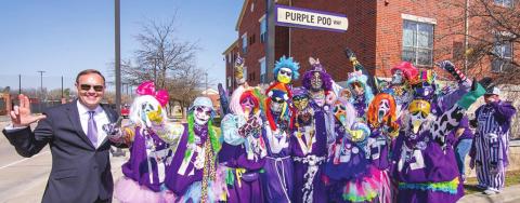Members of the Tarleton’s Purple Poo celebrate the naming of Purple Poo Way