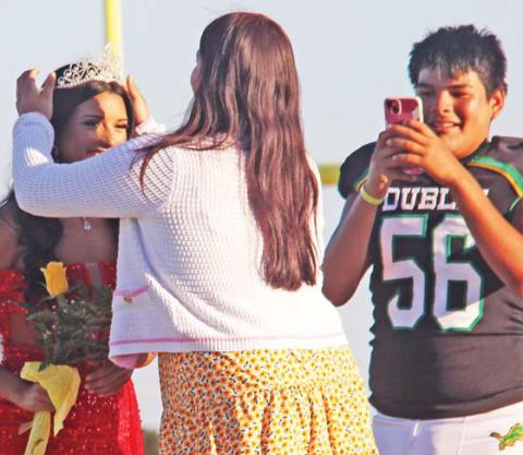 Homecoming Queen Kimberly Rojas is crowned by last year’s Homecoming Queen Sulmara Gonzalez. Rojas’ extremely proud brother, David Nava, escorted the senior and took photos. Wyndi Veigel-Gaudette | Citizen staff photo