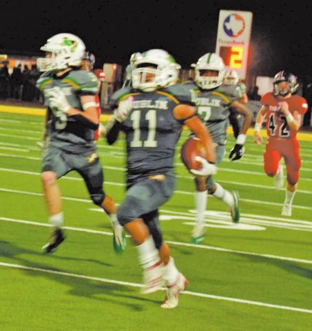 Dublin Lion Christian Ramirez is flanked by blockers Chris Teten and Javion Ray as he runs a 94-yard reception to the Anson Tiger goal line during Friday night’s home game. Paul Gaudette | Citizen staff photo