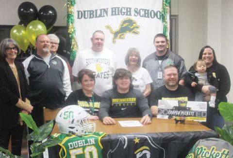 Present for Cooper Pickett’s signing to the Southwestern Pirates were: Cooper’s grandma Suzanne Heddins (back row, left to right), Athletic Director Greg Hardcastle, Grandfather Glenn Heddins, Stepfather Paul Tyus, Grandmother Cheryl Pickett, Coach Dalton Soullas, Stepmother Jena Pickett, brother Linden; Mother Lindsay Tyus (front row), Cooper Pickett, Father Michael Pickett. Both Griffin Pickett and Emma Tyus could not be there due to school schedules. Wyndi Veigel | Citizen staff photo