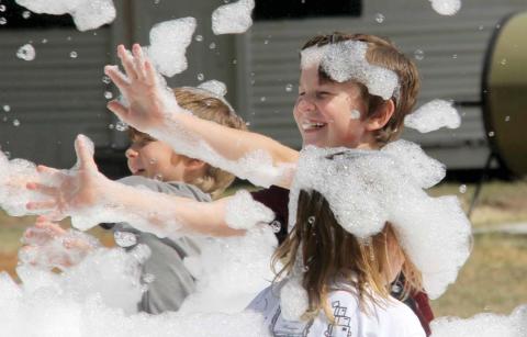 Kids play in the foam at the Back-to-School Fair at the Dublin Public Library Saturday, July 30. With a wide variety of donations from the surrounding communities, 200 free backpacks and school supplies were given away at the event. For more photos see page 8A and check out the Dublin Citizen Facebook page. Wyndi Veigel | Citizen staff photo
