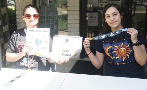 Library Director Adina Dunn and library staff member Daniela Carrillo hand out eclipse glasses Monday, April 8 prior to the total solar eclipse. The library also handed out interactive activities for kids. Dublin Historical Museum also provided glasses and they were provided with assistance from the Dublin EDC. Wyndi Veigel-Gaudette | Citizen staff photo