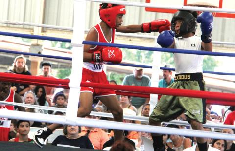 Two competitors face off against each other at a boxing match for the Hispanic Heritage Festival. The 2nd annual Lights Out Boxing Tournament featured 35 matches and was hosted by the Stephenville Boxing Club. Paul Gaudette | Citizen staff photo