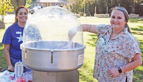 Star Council members make cotton candy at the Dublin Library Card Sign Up social Monday, Sept. 26 at the Dublin Public Library. Below, kids play games at the event. Paul Gaudette | Citizen staff photos