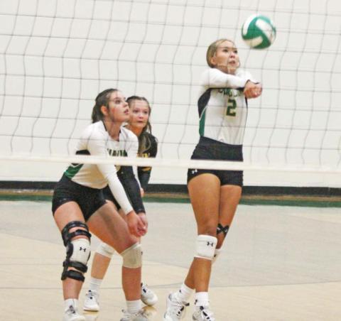 Dublin Lady Lion Bailey Watson returns the ball in an Aug. 8 home game against Hamilton while teammates Madison Turley and Paige Wilson move in to assist if needed. Paul Gaudette | Citizen staff photo
