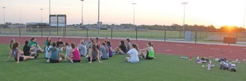 Dublin Lady Lion head volleyball coach Nikki Granath talks to DHS Lady Lions volleyball players as they sit on Cervetto Field following a run on the track. The teams will hit the court for the first time this season on Tuesday, Aug. 8 as the JV and Varsity Teams take on Hamilton in games starting at 4:30 p.m. They will follow this with an appearance in the Albany Tournament Aug. 10-Aug. 12. Paul Gaudette | Citizen staff photo