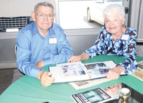 Jesse Weems and Delyn Alexander Spurgin of the Dublin High School Class of 1959 enjoy looking at a picture album together at the Dublin Area Reunion Saturday, June 10 at The Station. Wyndi Veigel | Citizen staff photo