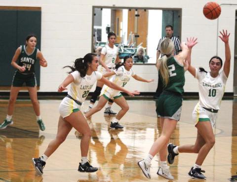 Lady Lions Emma Vargas, Wendy Calderon, NavaLee White and Olivia Salyer square up to block a pass from a Santo Wildcat ballcarrier during a Nov. 12 home victory on the Neff Gym hardwood. Paul Gaudette | Citizen staff photo