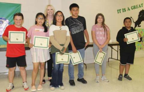 ‘Paws’itive Leaders Mason Joslin and Monserath Zuniga (4th grade), Ivan Gonzalez and Ximena Lopez (5th grade) and Serenity Cooper and Fabian Marin (6th grade). Presented by Intermediate School Principal Amanda Lisso.
