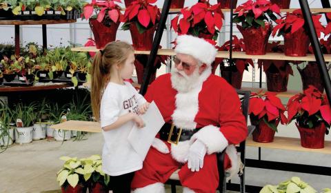 Quinn tells Santa what she would like for Christmas at Christmas in Bloom at Texas Sage Saturday, Nov. 16. The nursery offered holiday shoppers the chance to get some last minute fall plants, a jump start on holiday decorating and all kinds of door prizes at the event. For more photos see the Dublin Citizen Facebook page. Wyndi Veigel-Gaudette | Citizen staff photo