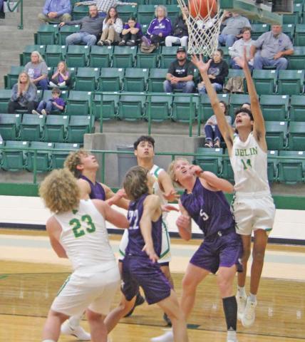 Dublin Lion Jayden DeLeon leaps up to rebound the ball around Cross Plains competition during the Tuesday, Nov. 19 home game. Paul Gaudette | Citizen staff photo