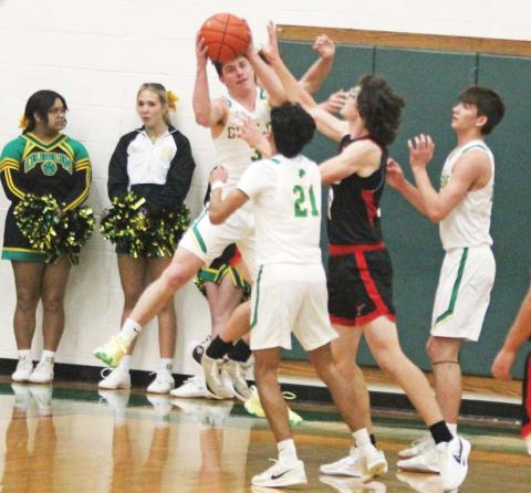 Dublin Lions swarm around an Eastland Maverick during the Jan. 7 home game to reclaim the ball under the net. Paul Gaudette | Citizen staff photo