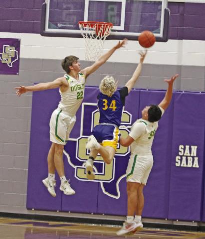 Dublin Lions Hunter Jones and Joe Salinas leaps up to block a shot from a Blanco ballcarrier in the Area playoff game held Friday, Feb. 27 in San Saba. Paul Gaudette | Citizen staff photo