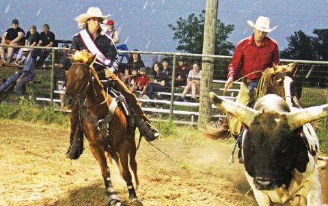 Two ropers compete at the Monta de Toros rodeo Saturday, May 6 despite pouring rain. For more rodeo photos see page B2 and the Dublin Citizen Facebook page. Paul Gaudette | Citizen staff photo