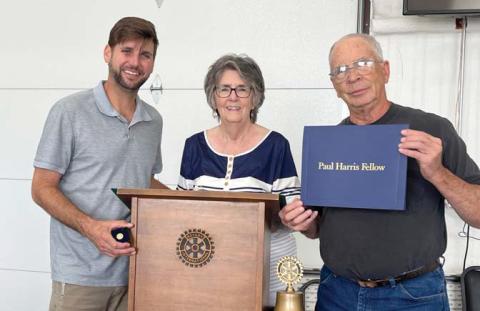 Lee Leatherwood, left, and Ben Pate, right, are presented the Paul Harris Fellow by Dublin Rotary Board President Karen Wright at their Tuesday, July 22 weekly meeting. Submitted photo