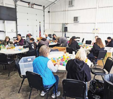 Volunteers help fill Easter eggs for the Dublin EGGStravaganza in a morning event Saturday, March 8 at the Station next to First National Bank of Dublin. Paul Gaudette | Citizen staff photo