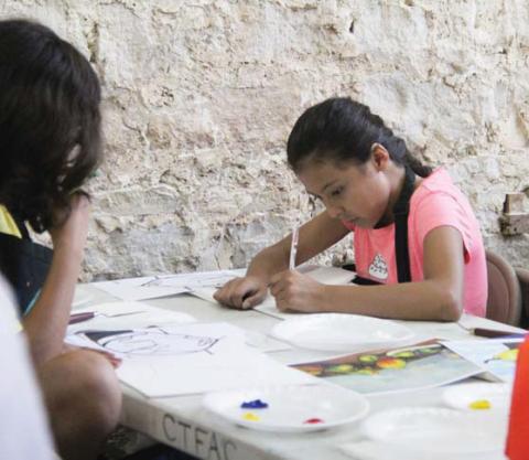 Art camp participants draw a pear with a paint-by-numbers to complete their own impressionist painting. Wyndi Veigel | Citizen staff photo