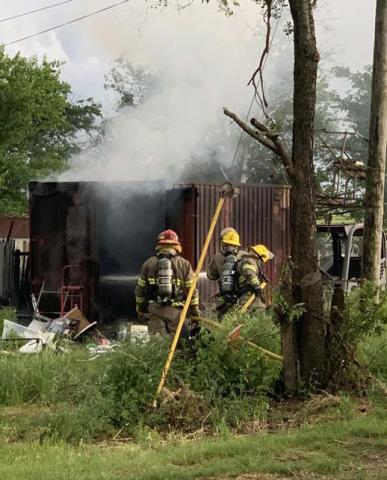 Members of the Dublin Volunteer Fire Department fought a container fire Friday, May 5 on Central Street. According to Fire Chief Paul Warner there was ammo and reloading supplies in the container, making the department take their time with the approach and cooling down the container prior to entering it. According to the Erath County Fire Marshal’s office, preliminary investigation is leading to the fire’s cause being electrical. Submitted photo