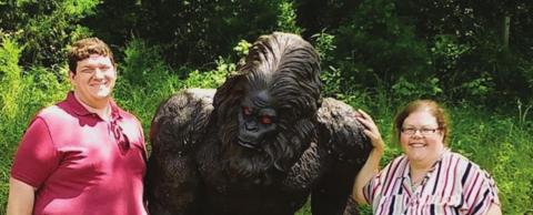 A pair of editors pose with a seemingly uncomfortable Bigfoot in Jefferson, Texas