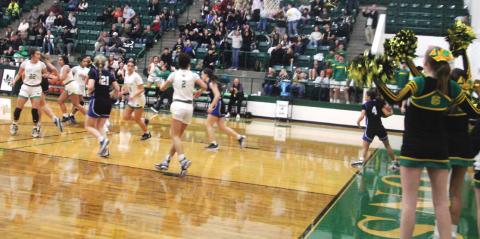 Dublin Cheerleaders and fans were on their feet (and in the air) in excitement Jan. 21 as the Lady Lions traded points with Peaster in overtime on the home court. Paul Gaudette | Citizen staff photo