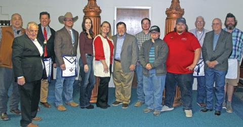 Paul Bradberry, center, is presented with the Community Builder Award from Dublin’s Masonic Lodge No. 504. He is surrounded by his wife, Terah and children, Brittney, Zachary, Colton and Mathew Bradberry, along with Masonic Lodge members. Paul Gaudette | Citizen staff photo