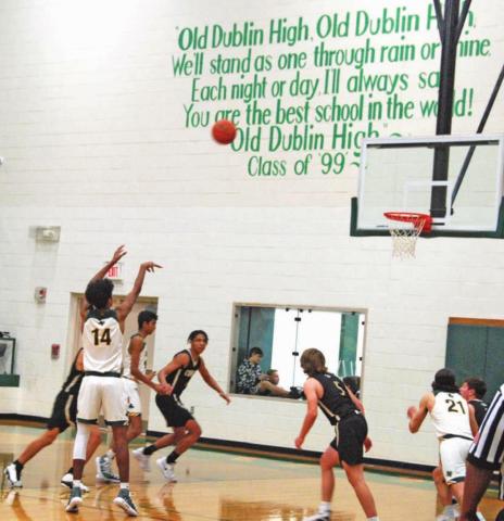 Dublin Lion Dalan Rasberry tosses the ball over Comanche defense during the 56-40 home win Friday night. Paul Gaudette | Citizen staff photo
