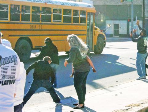 The Dublin Lions threw bracelets to fans as they rounded the Corner Lot (above) on their way to an 85-82 victory against Holliday at Weatherford Friday night. The Lions advanced to the Area Playoffs on Wednesday night as they faced Wall at Howard Payne University. Results of that game will be available at dublincitizen.com and in next week’s edition. Paul Gaudette | Citizen staff photo