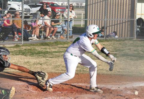 Dublin Lion Dalton Bullard leans in to bunt a ball back to Comanche to help his teammates move across bases in the Tuesday, March 18 home game against the Comanche Indians. Paul Gaudette | Citizen staff photo
