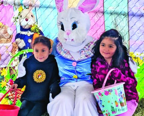 Kids enjoy spending time with the Easter bunny at the annual community-wide egg hunt. Paul Gaudette | Citizen staff photo