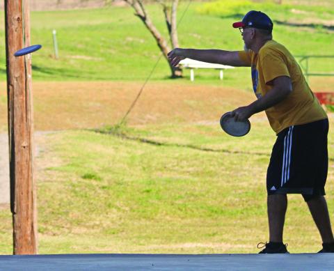 A disc golfer lets a frisbee fly at the annual Shamrock Shootout held Saturday, March 21. The event was held by the Dublin Disc Golf Association at the City Park. Wyndi Veigel-Gaudette | Citizen staff photo