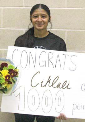Lingleville senior Ciklali Rangel was presented with flowers and a sign when she reached 1,000 career points Jan. 24. Paul Gaudette | Citizen staff photo
