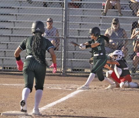 Dublin Lady Lion Adriana Stewart steps off third to head for home as Izzy Cervantes swings in the home game against Eastland Friday, March 20. Paul Gaudette | Citizen staff photo
