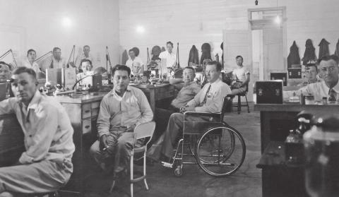 The Swindle’s School taught men who were crippled by Polio or in military service to earn a living doing watch repair. Grady Swindle’s kind words taught the men they could still lead a good life even with a disability. Mr. Swindle is in the center of the photo in the wheel chair. Tom Rogers | Ralph and Dossie Rogers Collection Tarleton University