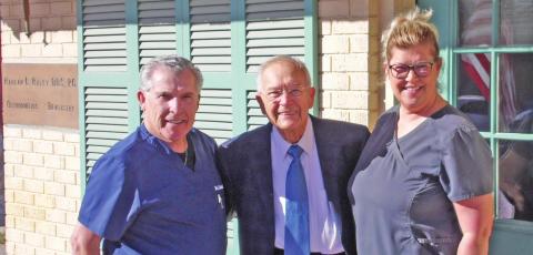 Dr. Thomas Carroll, Dr. Harlan Raley and Monica Fenn pose in front of Raley’s dental office, which opened in 1951. Raley was joined by friends and neighbors Saturday in celebrating 70 years of practicing dentistry in Dublin. Carroll recently purchased the office but will keep the practice in Raley’s name and keep him on as an employee as long as he would like. Paul Gaudette | Citizen staff photo