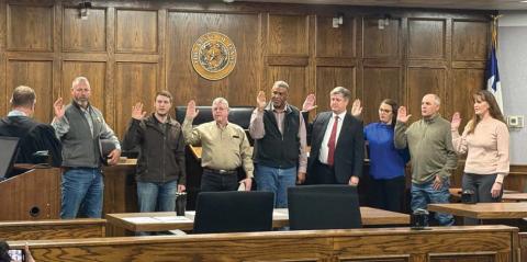District Court Judge Jason Cashon swears in newly elected public officials Jan. 1, 2025. From left is Sheriff Matt Coates, Constable Precinct 2 Ryan Gibson, Constable Precinct 1,3, 4 Jason Schipper, County Commissioner Precinct 3 Sherman Edwards, District Attorney Alan Nash, Tax Assessor-Collector Valerie Stephen, County Commissioner Precinct 1 Dee Stephens and County Attorney Bethany Espinoza. Courtesy photo