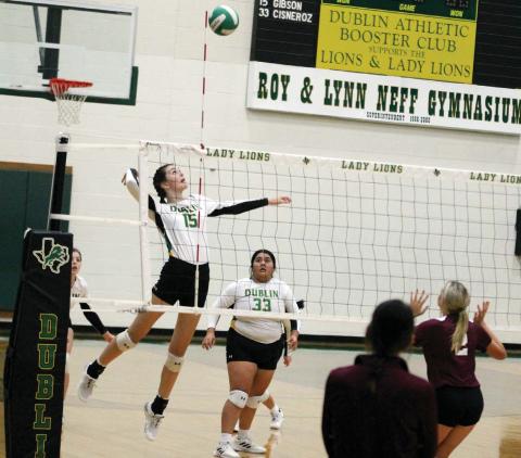 Paul Gaudette | Citizen staff photo Dublin Junior Jaclyn Gibson leaps up to return the ball in Saturday’s home game against DeLeon.