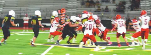 The JV Dublin Lions move in to advance the ball against Eastland in their final game of the 2020 season Thursday at home. The match resulted in a loss for the home team. Paul Gaudette | Citizen staff photo
