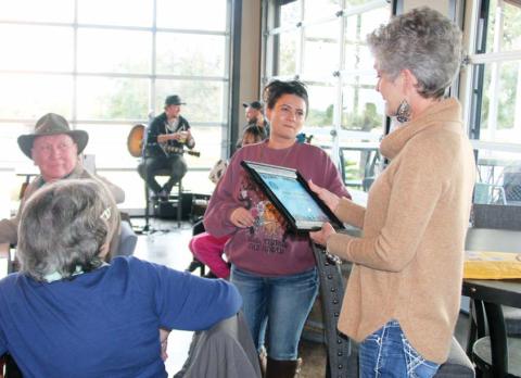 Meghan Hokanson looks on while Janice Chandler presents the Citizen of the Year award to her on behalf of the Dublin Chamber of Commerce. Meghan received the award due to her help in the community through Titan Fitness and for her work on the Shamrock Shuffle. The award was presented to her at Lucky Vines Saturday, Nov. 19. Wyndi Veigel | Citizen staff photo