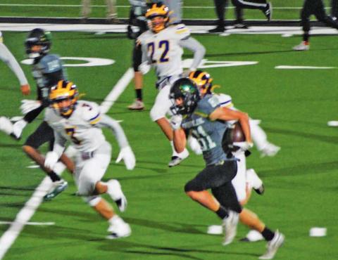 Dublin Lions move the ball up field against Merkel in the home game Friday night. Sara Gann | Citizen staff photo