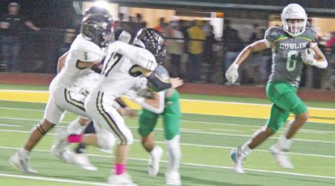 Dublin Lion Ayden Vargas sweeps left around Comanche defense while teammates block during the Oct. 20 home game. Paul Gaudette | Citizen staff photo