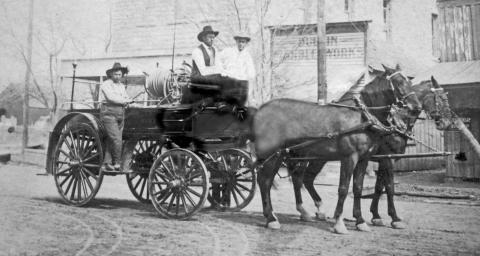 Riding on the Dublin Fire Department chemical wagon is Fire Department Chief W.P. Hallmark on the running board. Seated are City Marshal White and possibly Dr. Goodner, Mayor of Dublin. This photo was taken in front of City Hall on Blackjack St. Later in the year the Knights of Pythias building was built to the left in the photo. | submitted photo