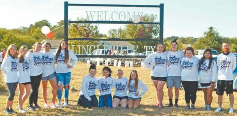 The Lingleville Lady Cardinals were joined at the ‘Welcome to Lingleville’ sign Sunday by community members wishing the District Champions well as they advanced to Area competition. Paul Gaudette | Citizen staff photo